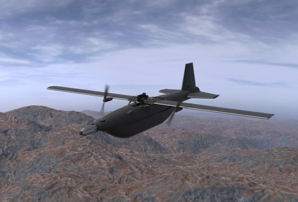 Το AHM-2X σε πτήση πάνω από ορεινή περιοχή